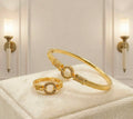 Gold-plated infinity wave bangle and ring set with solitaire center stone